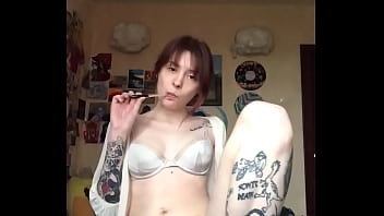 Passionately masturbating pussy with a dildo