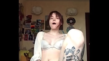 Passionately masturbating pussy with a dildo