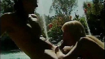 Blonde with massive boobs riding cock by the pool