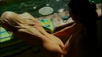 Blonde with massive boobs riding cock by the pool