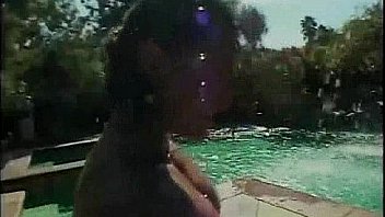 Blonde with massive boobs riding cock by the pool