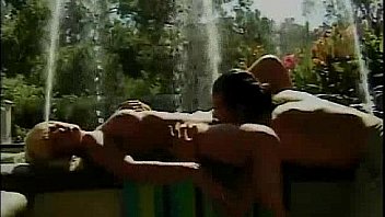 Blonde with massive boobs riding cock by the pool