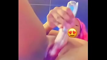 Fucking herself with a toy