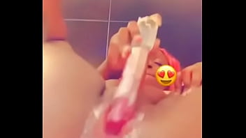 Fucking herself with a toy