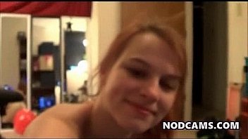 Curvy redheaded chick rides a real cock