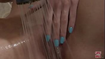 Shy redhead and a shower head