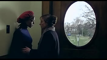 Lesbian kiissing behind doors