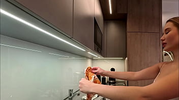 Big tits big ass beautiful and cute blonde in the kitchen in a short skirt shows her long legs and gets bored and ignored