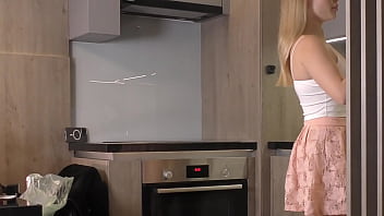 Big tits big ass beautiful and cute blonde in the kitchen in a short skirt shows her long legs and gets bored and ignored