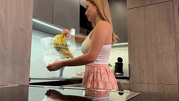 Big tits big ass beautiful and cute blonde in the kitchen in a short skirt shows her long legs and gets bored and ignored
