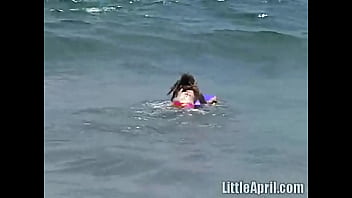 Teen girl little april in the ocean Teen girl little april in the ocean