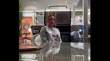 Busty babe flashes her tits all over the home store