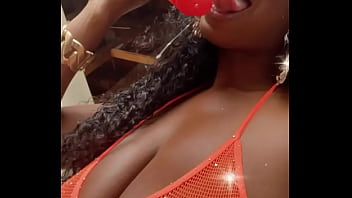 Wet lips licking a thick dildo