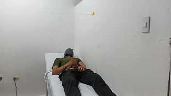 Kinky doctor masturbates his cock in the office