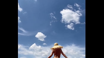 Sexy stepmother walks naked in the field