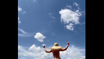 Sexy stepmother walks naked in the field