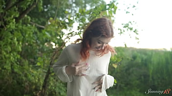 Teen redhead mia hits a wild orgasm beside the lake