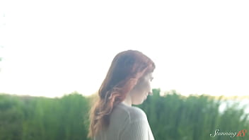 Teen redhead mia hits a wild orgasm beside the lake