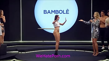 Cute bikini babe shows off her hulahoop skills as the camera zooms into her ass