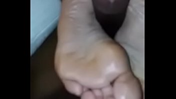 Black footjob showing soles
