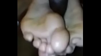 Black footjob showing soles