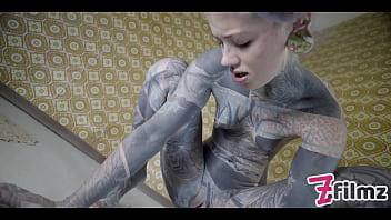 Alternative tattoo model masturbating with big toy