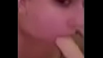 Loves sucking big dildo