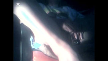 The camera under the table captured a beautiful woman at home alone and watching a porn movie