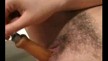 Busty milf inserts machine tools in her holes