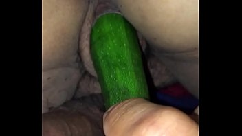 Playing with girlfriends pussy with veggie