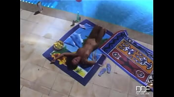 Venus fucks herself by the pool
