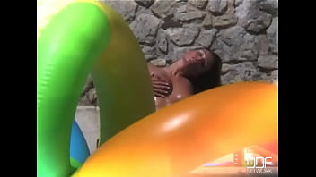 Venus fucks herself by the pool