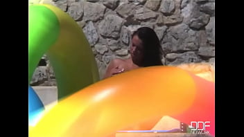 Venus fucks herself by the pool