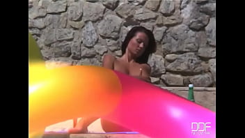 Venus fucks herself by the pool