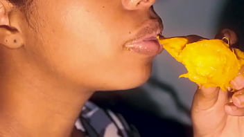 Lustful latina eating a mango the sexy way