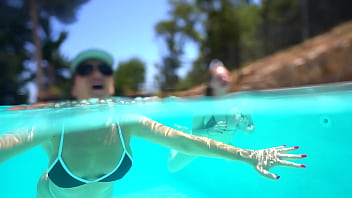 Underwater lesbian strap on sex