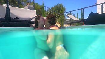 Underwater lesbian strap on sex