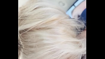 Blonde streetwalker takes a facial in public