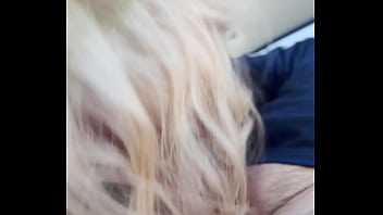 Blonde streetwalker takes a facial in public