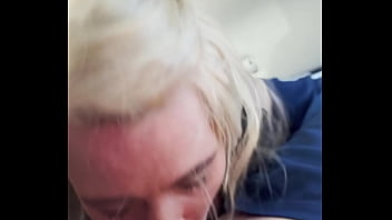 Blonde streetwalker takes a facial in public