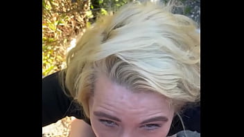 Blonde streetwalker takes a facial in public