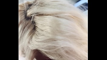 Blonde streetwalker takes a facial in public