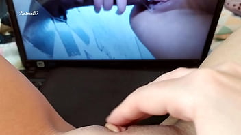 Rubs her clitoris under hot porn