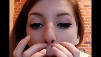 Hot beautiful girl picking her nose