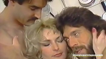 Beautiful vintage babe handles two dicks