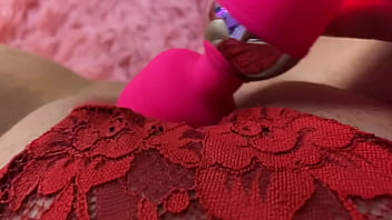 Lady in red lingerie plays with her puffy wet pussy