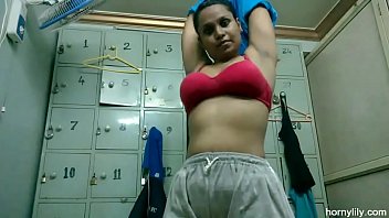 Horny lily changing her dress in store room