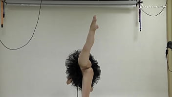 Russian brunette acrobat stretching her sexy long legs