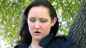 Flower girl rubs a glass dildo on her beautiful breasts