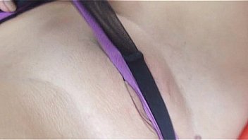 Brunette masturbating with her feet